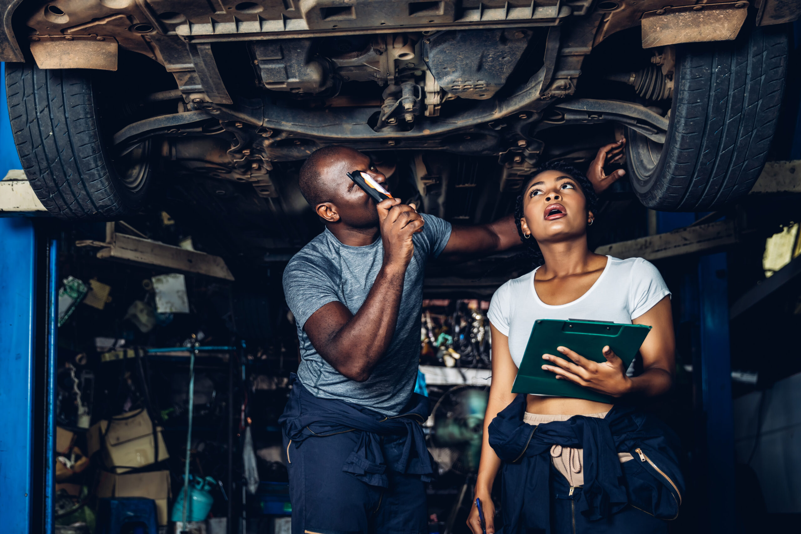 professional car mechanic is investigating under a 2025 03 16 00 14 08 utc scaled