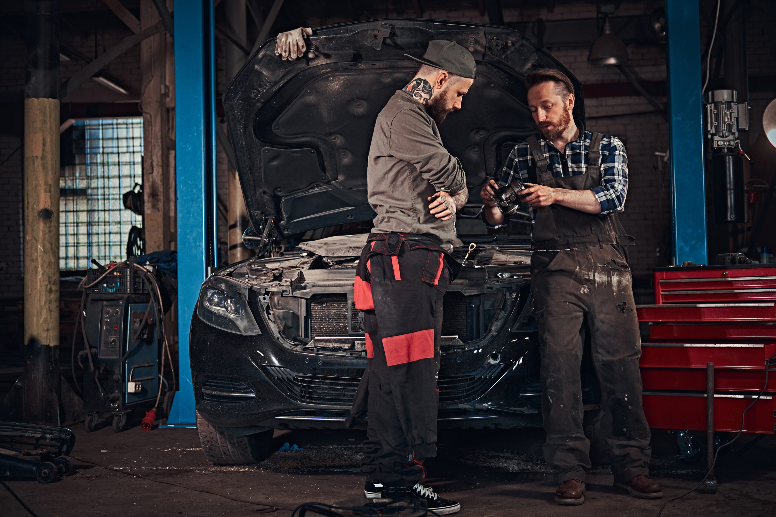 two bearded auto mechanic working in repair garage 2025 01 25 11 53 21 utc scaled